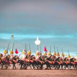 A captivating scene of Moroccan horsemen performing a traditional Fantasia charge in El Jadida.