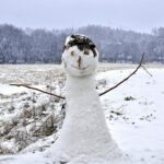 Charming snowman amidst a snowy landscape in Ifrane, Morocco during winter.